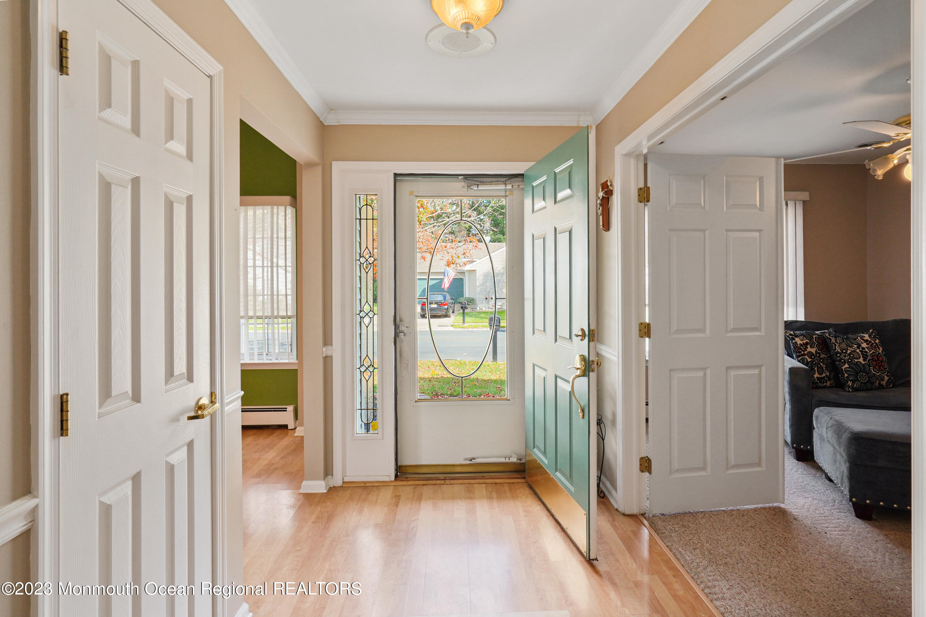 7 Portebello Road Jackson, NJ 08527 - Photo 7 of 49 a view of a hallway with wooden floor and a bathroom