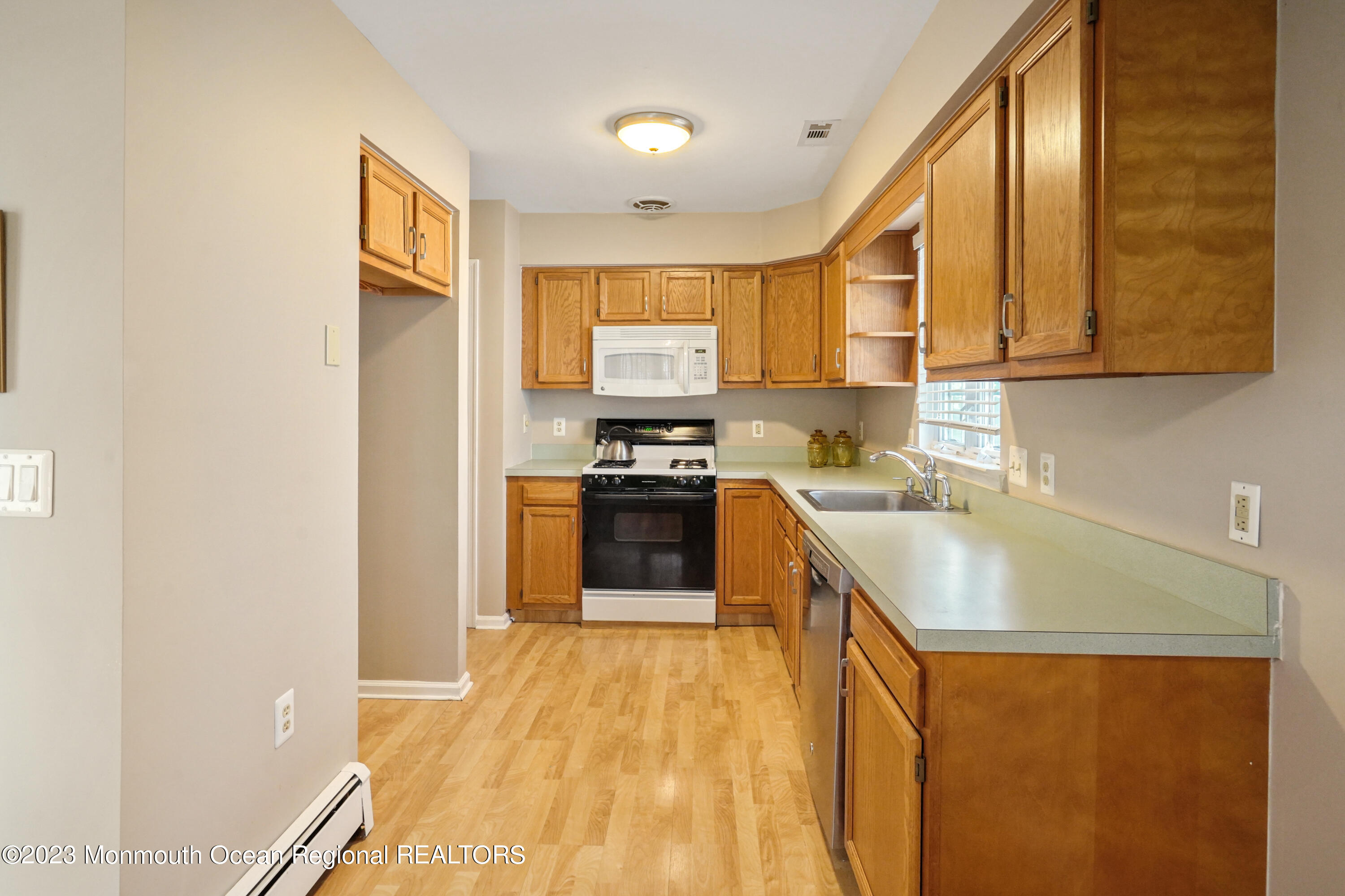 7 Portebello Road Jackson, NJ 08527 - Photo 9 of 49 a kitchen with stainless steel appliances granite countertop a sink and a refrigerator