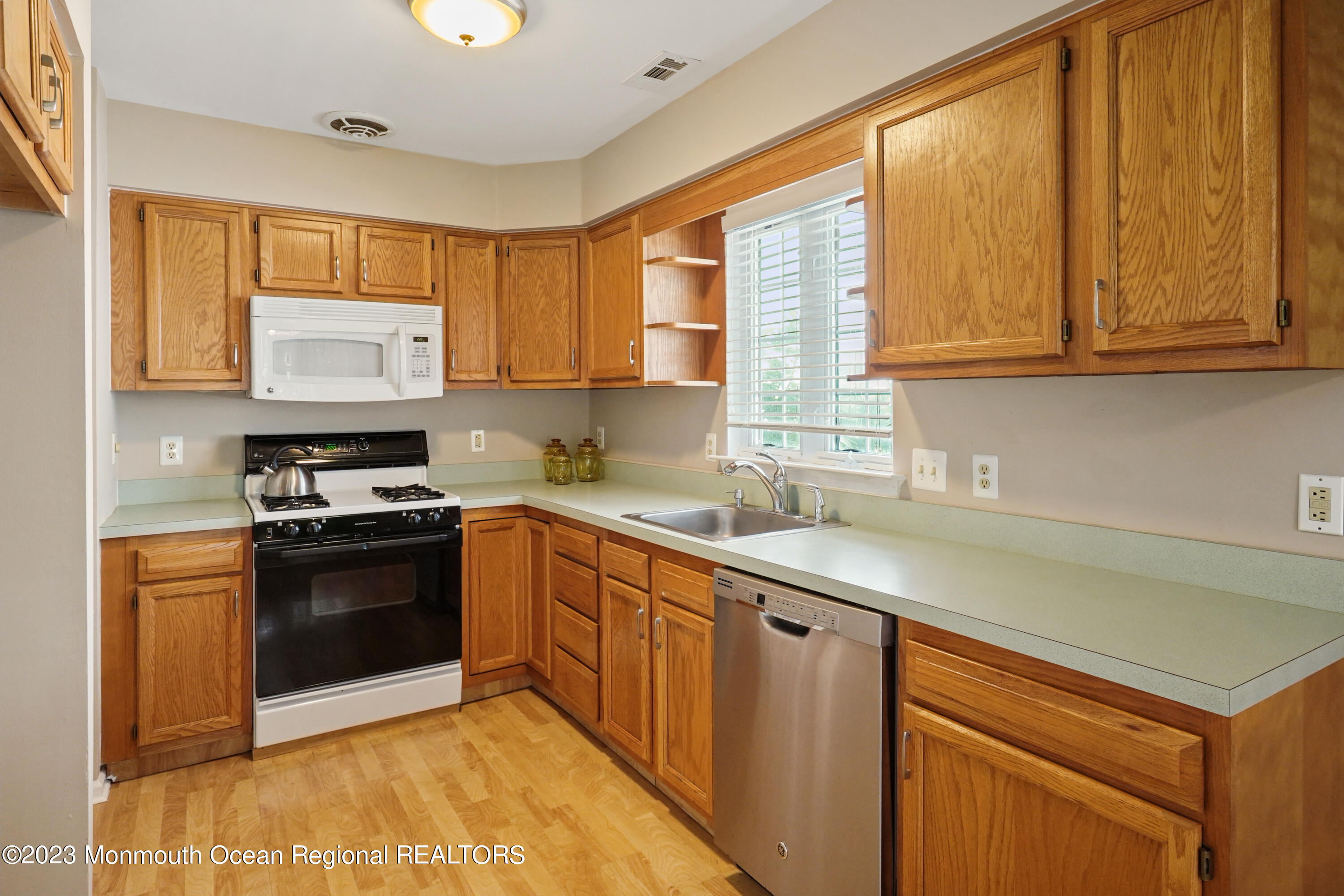 7 Portebello Road Jackson, NJ 08527 - Photo 10 of 49 a kitchen with stainless steel appliances granite countertop a sink stove and cabinets