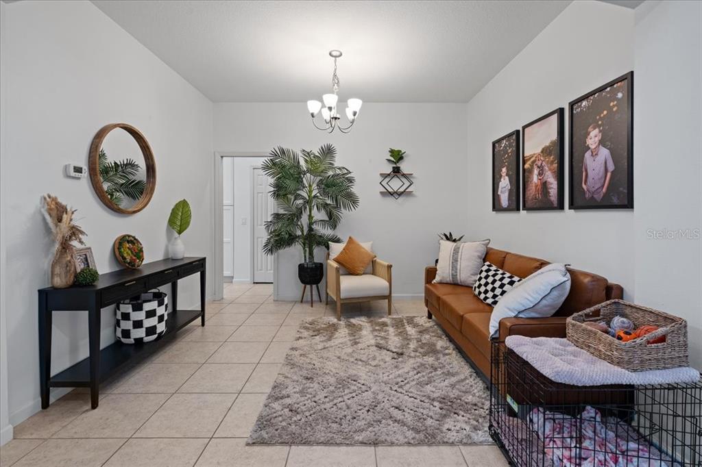 3271 Titanic Circle, Unit 39 Indialantic, FL 32903 - Photo 9 of 60 a living room with furniture and wooden floor
