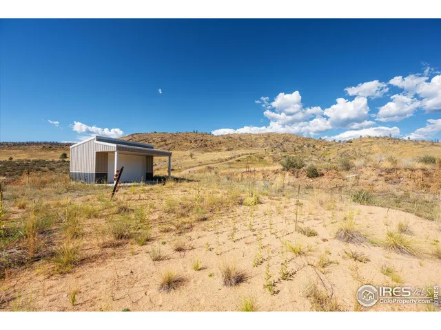 a view of a dry yard with mountain
