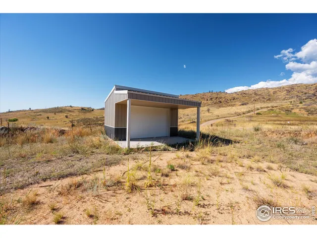 a view of a large mountain with mountains in the background