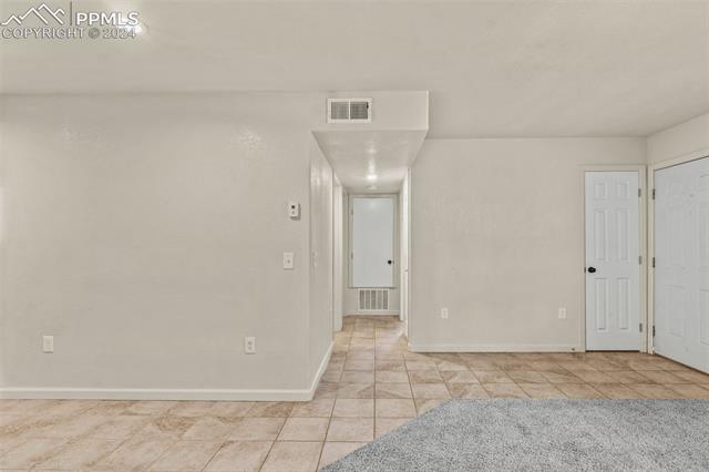 View of tiled spare room