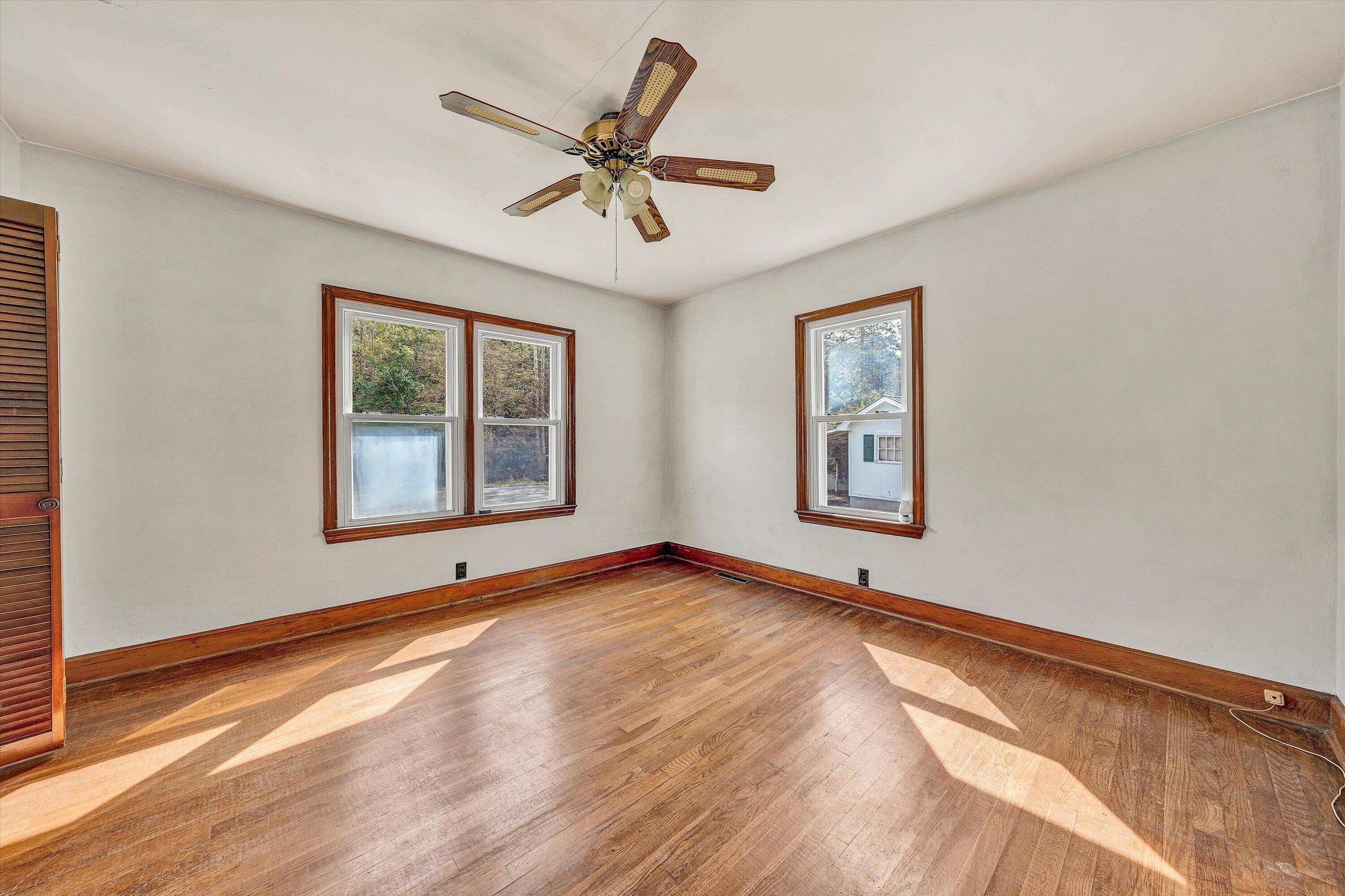 3145 Doe Run Road Rocky Mount, VA 24151 - Photo 15 of 38 a view of an empty room with window and wooden floor