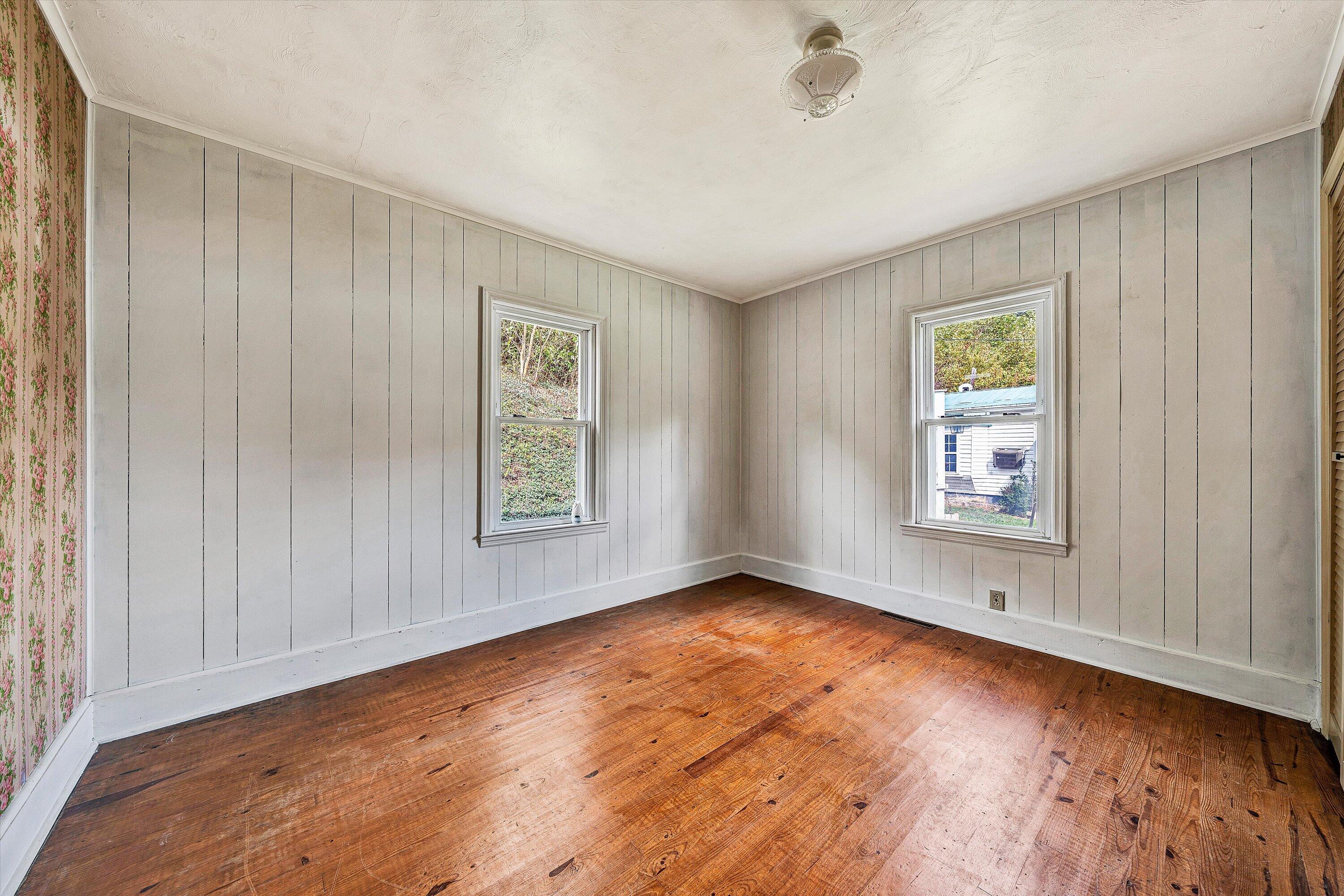 3145 Doe Run Road Rocky Mount, VA 24151 - Photo 17 of 38 a view of an empty room with window and wooden floor