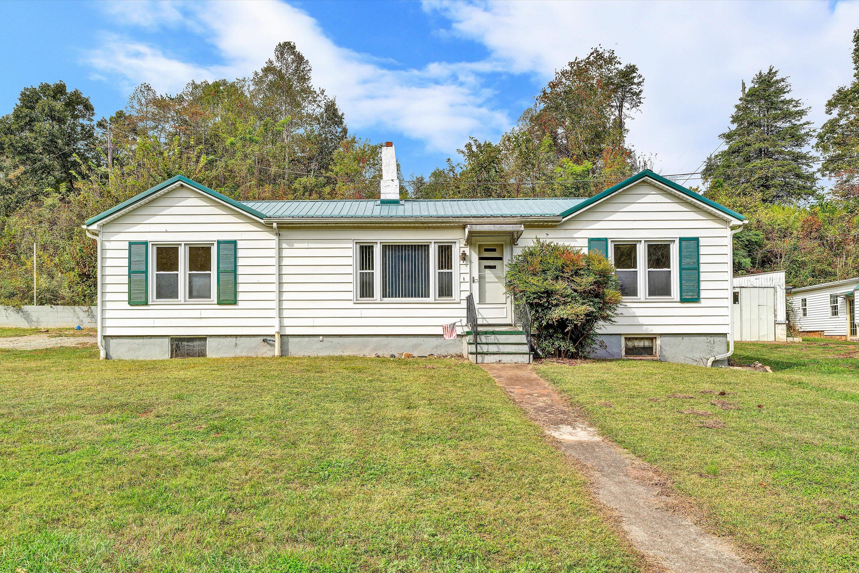 3145 Doe Run Road Rocky Mount, VA 24151 - Photo 2 of 38 a front view of a house with a yard