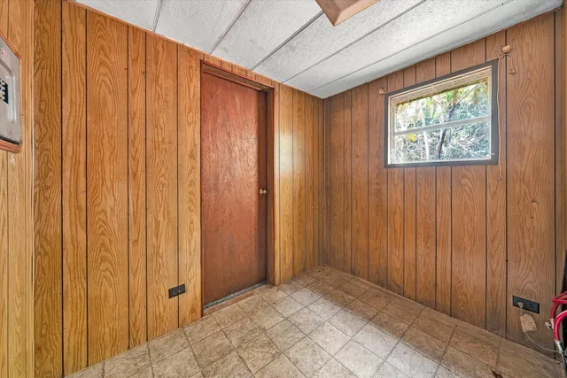 a view of an empty room and a window