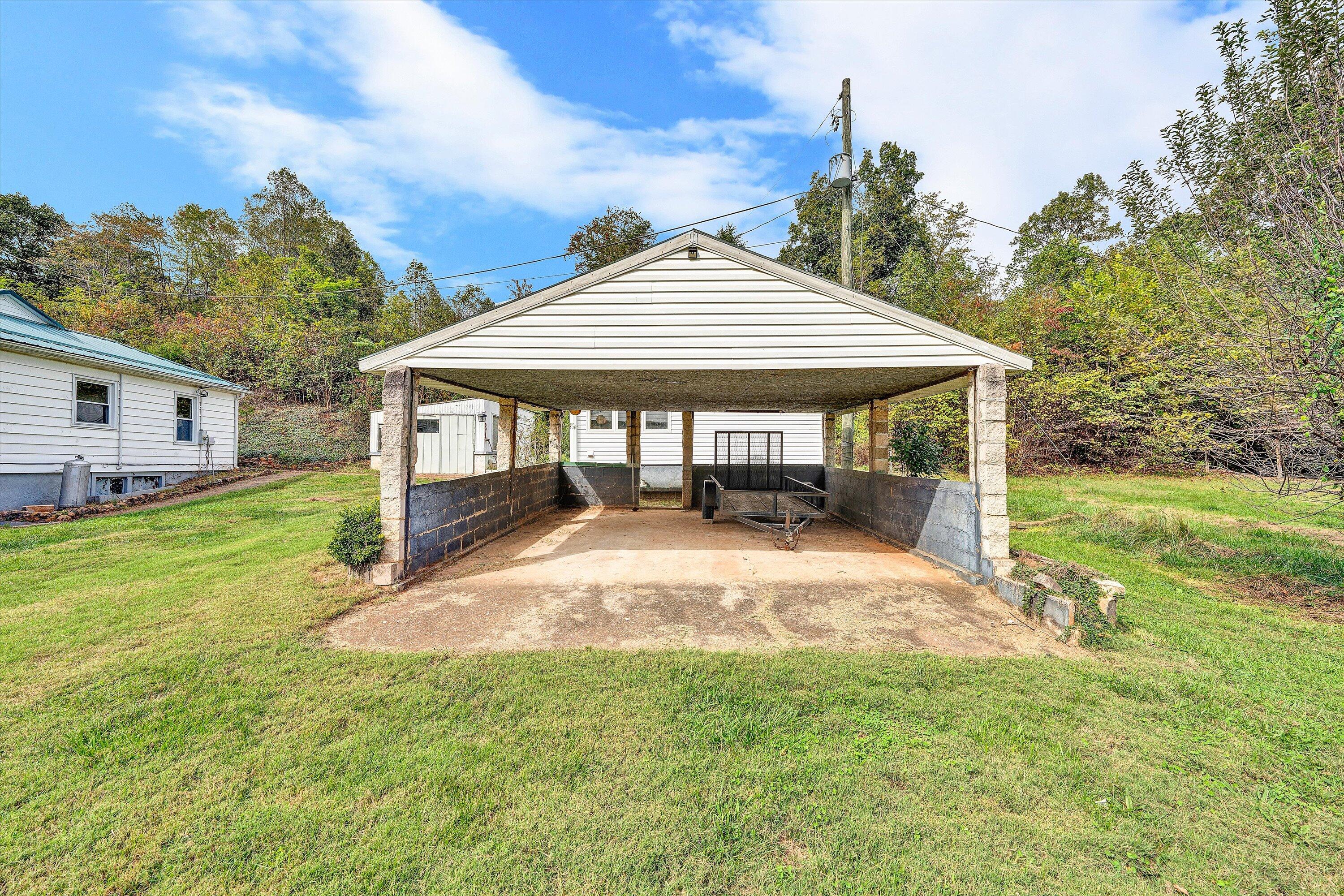 3145 Doe Run Road Rocky Mount, VA 24151 - Photo 34 of 38 a view of a house with backyard and sitting area