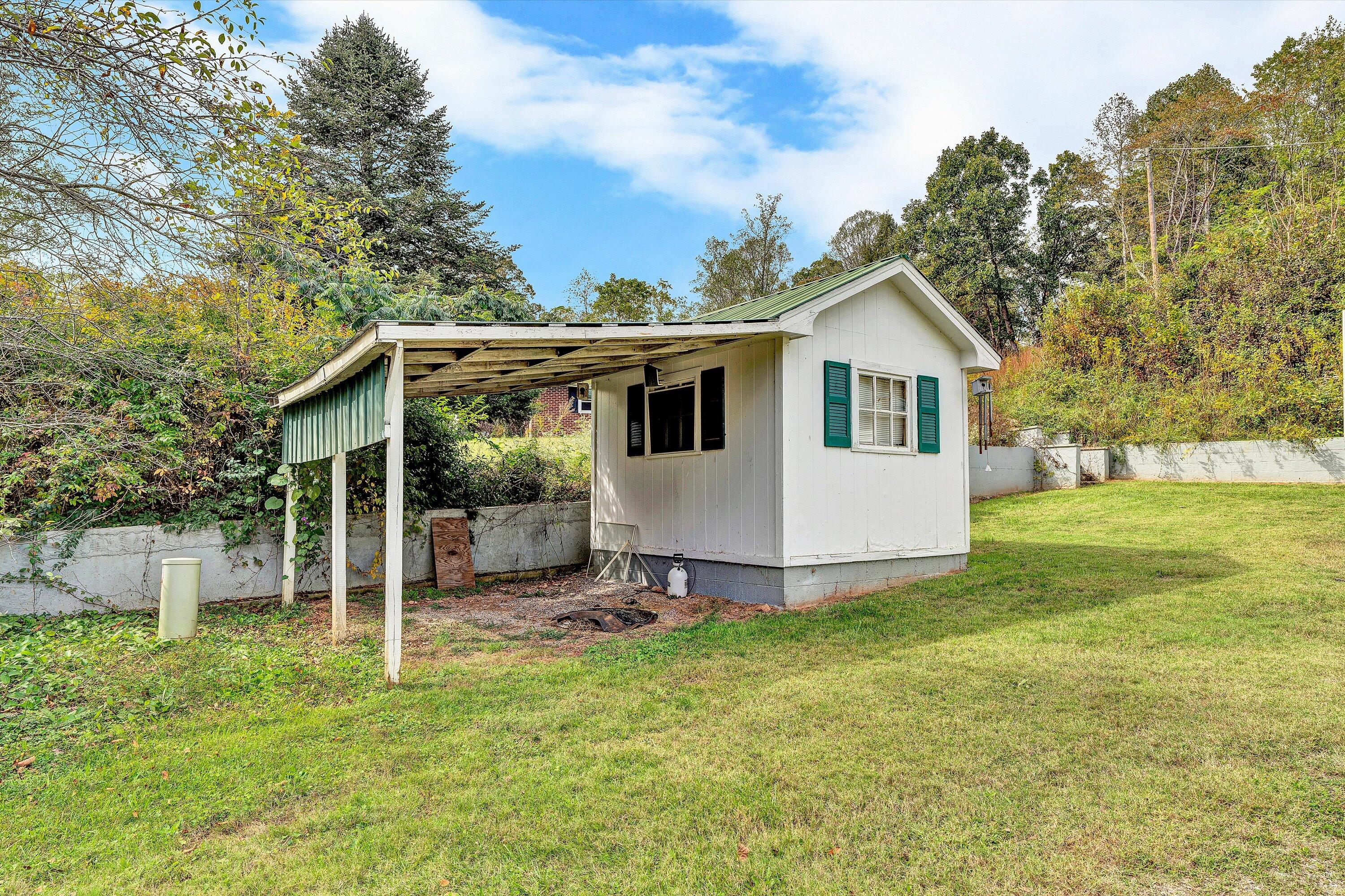 3145 Doe Run Road Rocky Mount, VA 24151 - Photo 4 of 38 a view of a house with backyard and sitting area