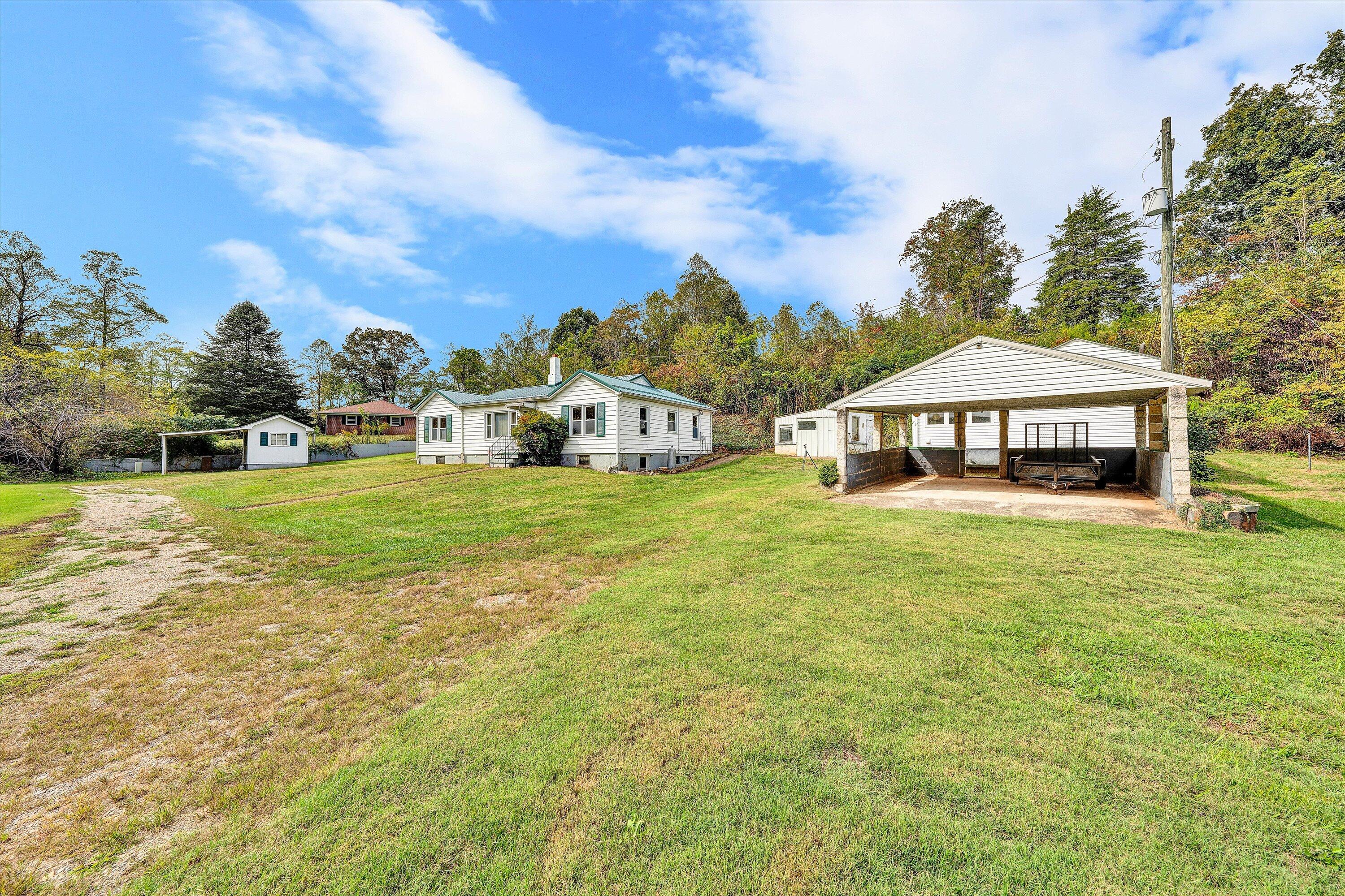 3145 Doe Run Road Rocky Mount, VA 24151 - Photo 5 of 38 a front view of a house with garden