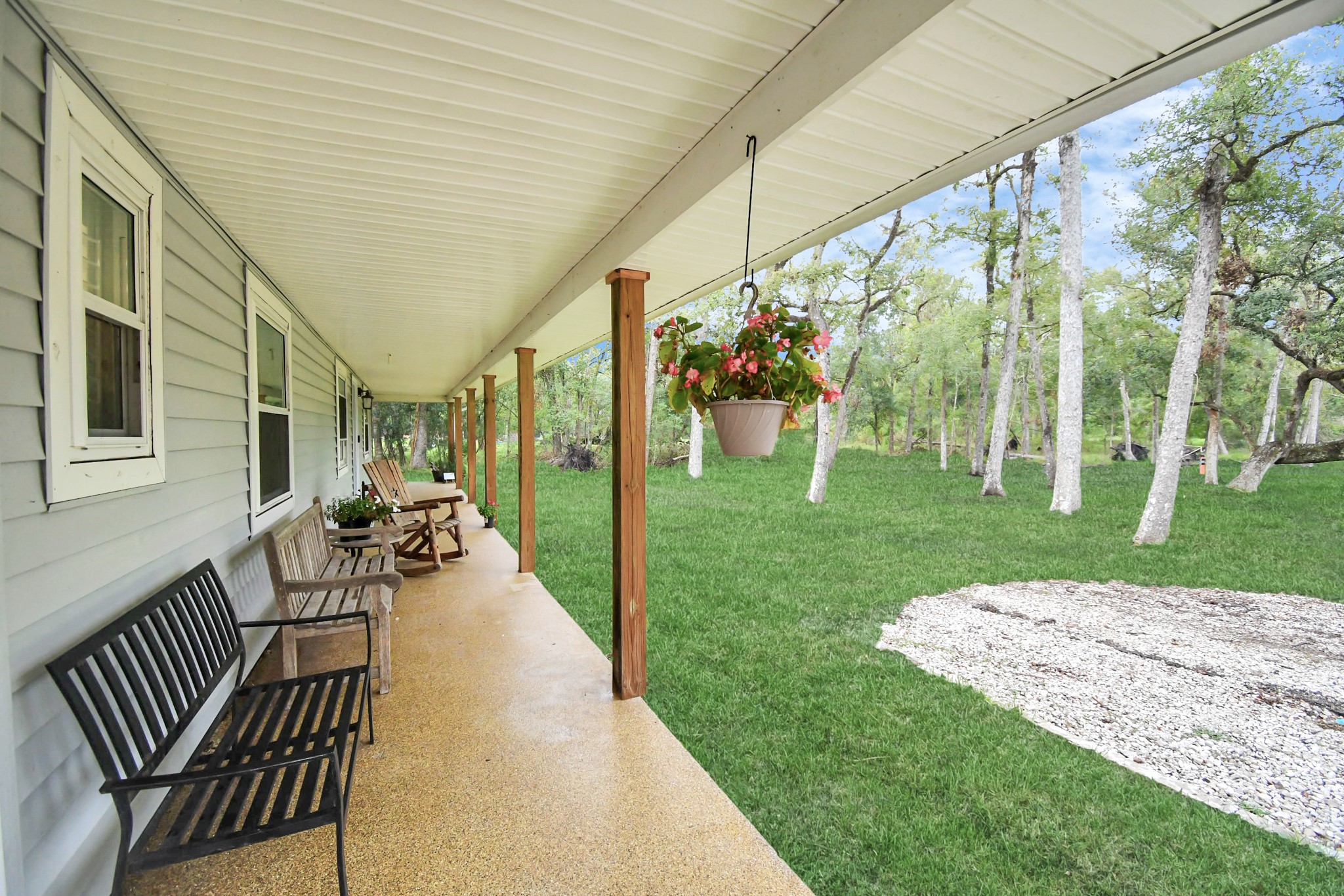 20202 Deer Run Road Damon, TX 77430 - Photo 8 of 45 a view of a porch with furniture and garden