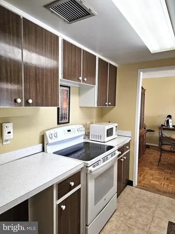 a kitchen that has a sink and a stove