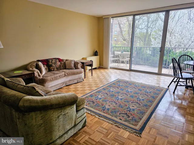 a living room with a couch and a large window