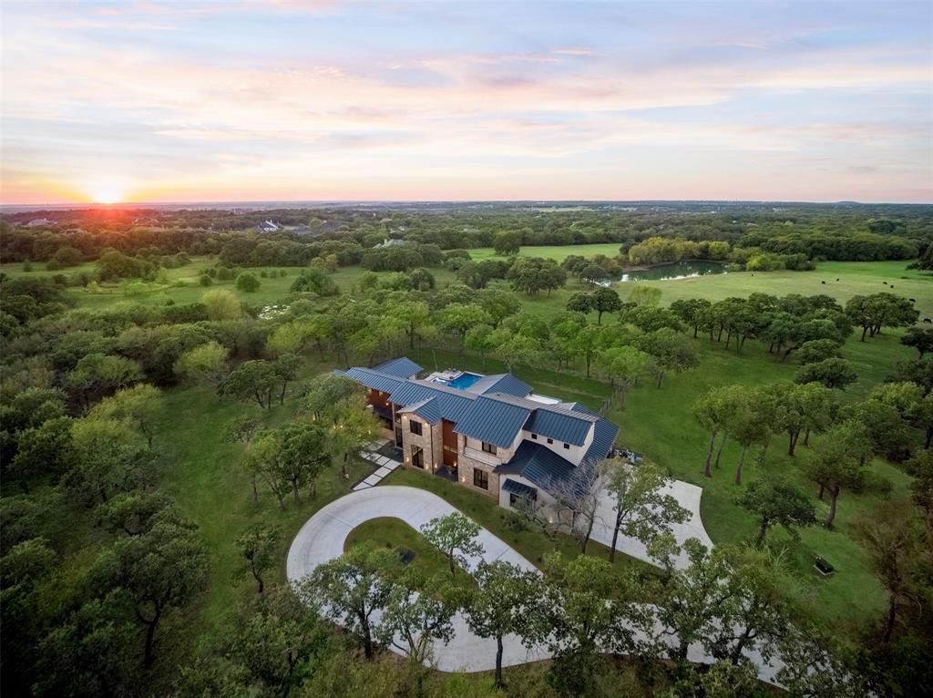 1200 Rockgate Road Argyle, TX 76226 - Photo 1 of 1 an aerial view of a house with a garden