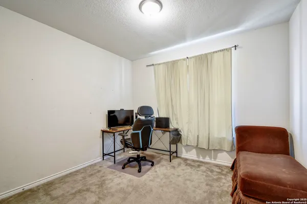 a view of workspace with lounge chair