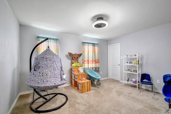 a room with toys and white walls