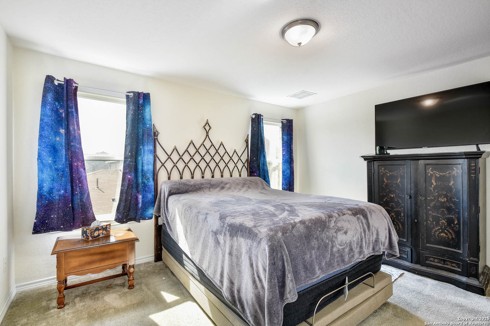 145 Rustic Universal City, TX 78148 - Photo 25 of 25 a bedroom with a bed and a flat screen tv