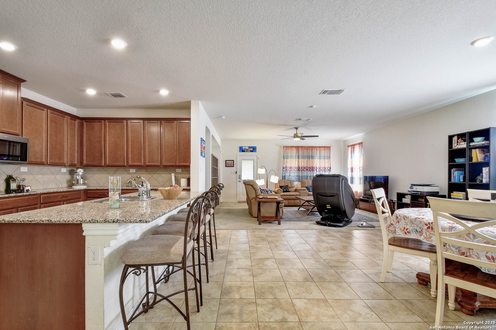 145 Rustic Universal City, TX 78148 - Photo 4 of 25 a living room with fireplace furniture and a flat screen tv