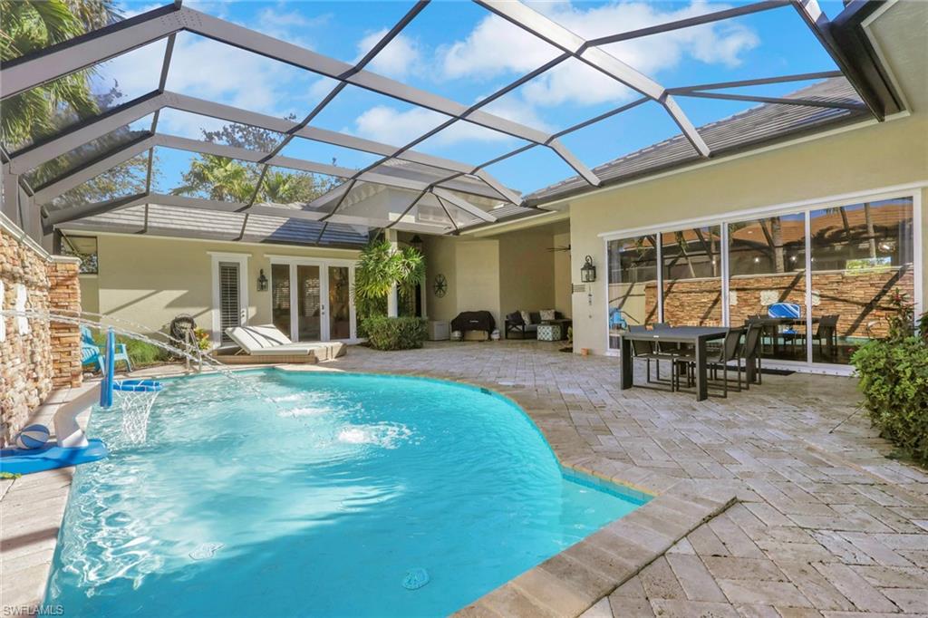 a view of a backyard with a patio and a patio