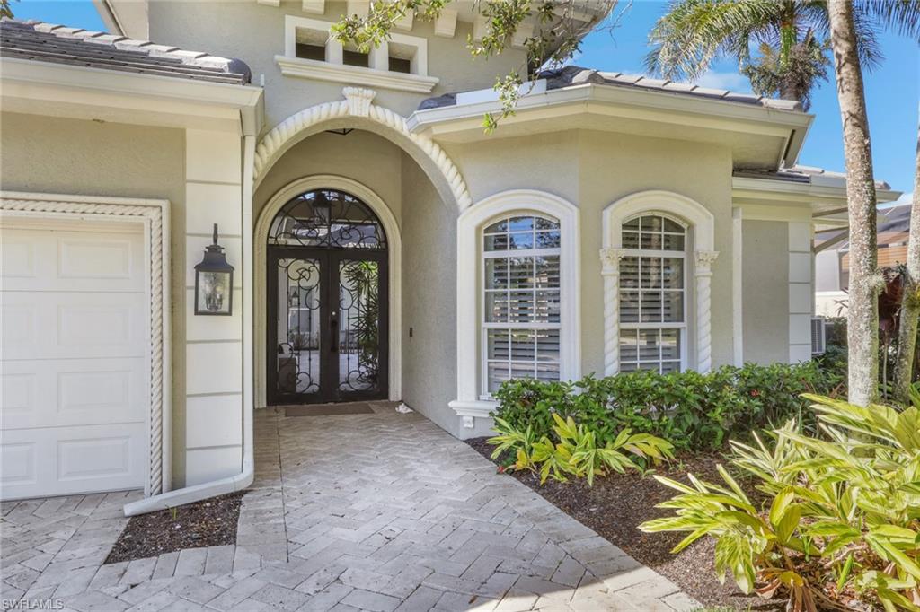 5074 Rustic Oaks Circle Naples, FL 34105 - Photo 3 of 38 a view of front door of house