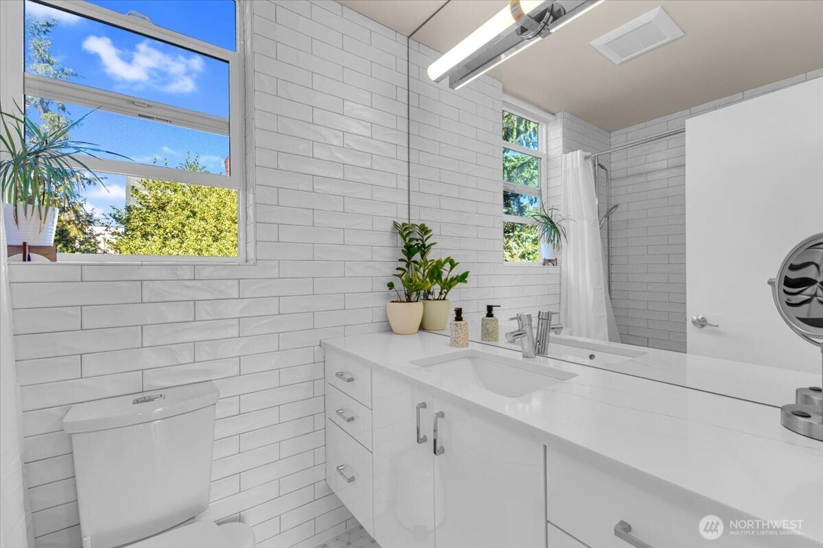 1602 East Marion Street Seattle, WA 98122 - Photo 16 of 28 a bathroom with a sink and a mirror