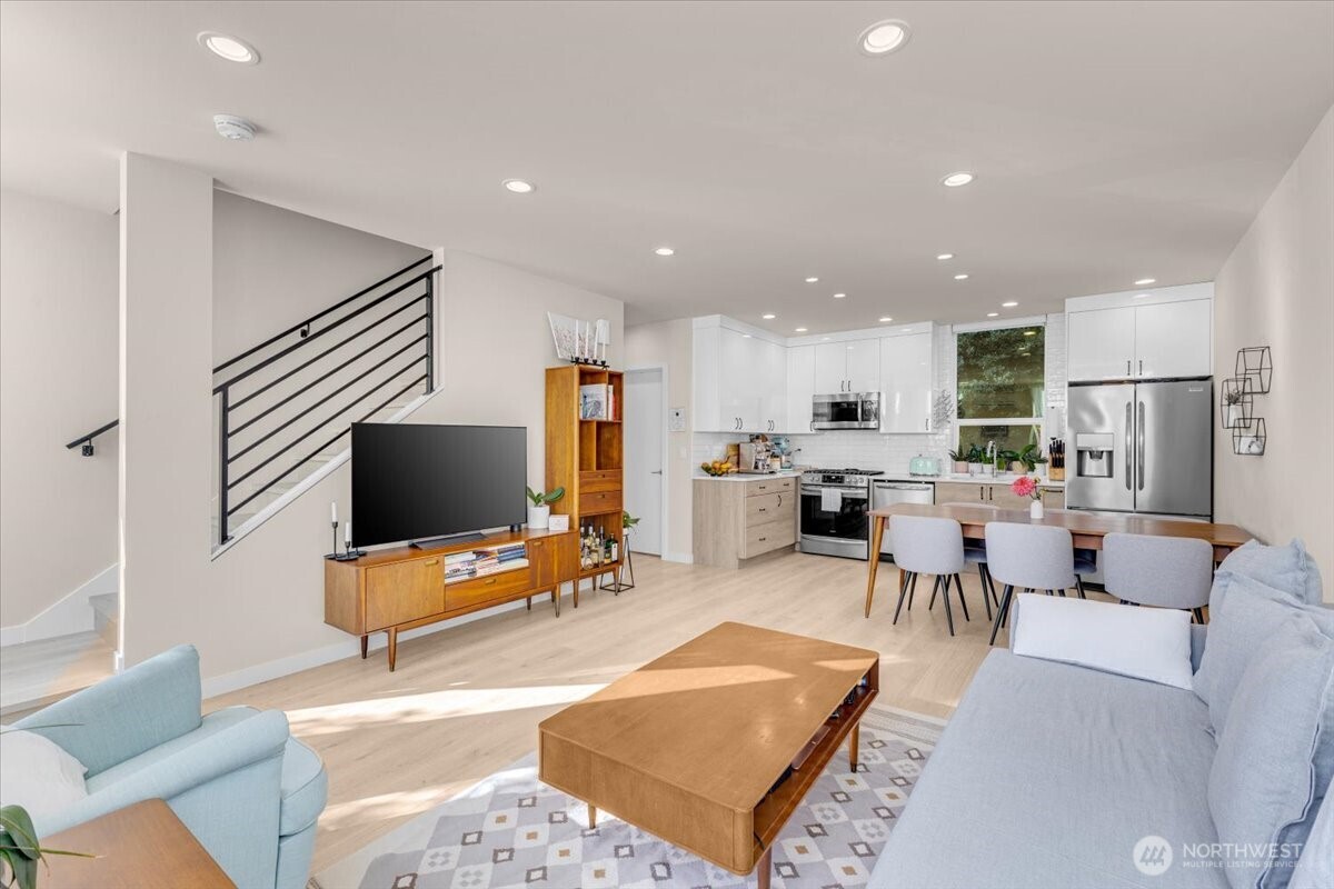 1602 East Marion Street Seattle, WA 98122 - Photo 9 of 28 a living room with furniture and a flat screen tv