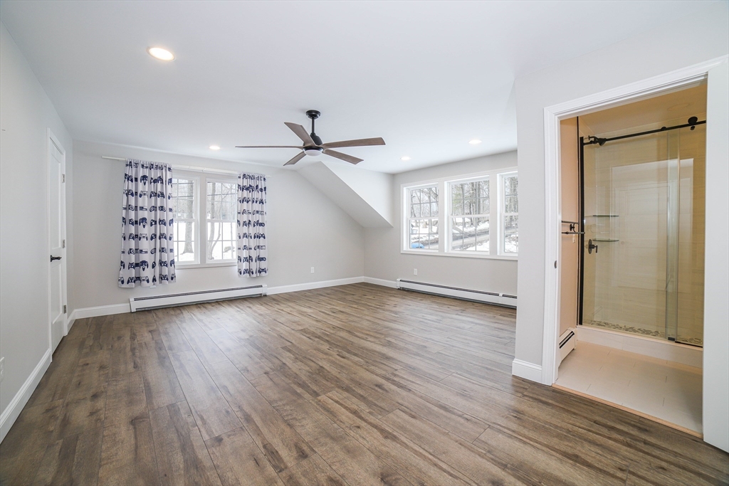 3 Woods Road Westminster, MA 01473 - Photo 31 of 42 a view of an empty room with a window and wooden floor