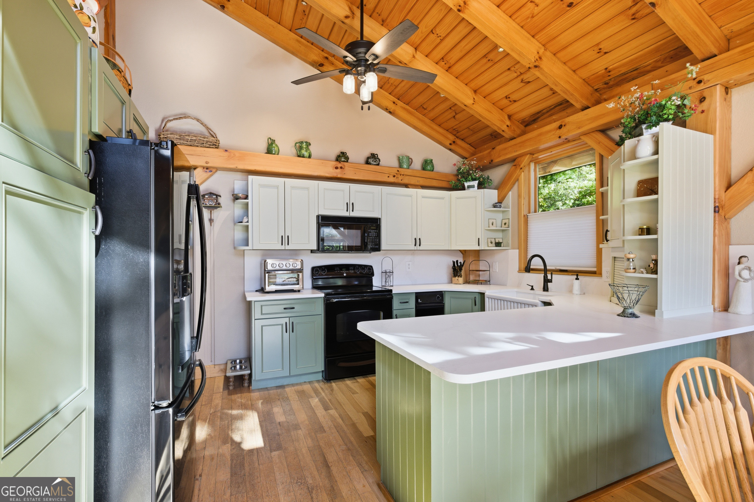 526 Grandaddy Still Road Scaly Mountain, NC 28775 - Photo 12 of 65 a kitchen with stainless steel appliances a stove a refrigerator and a sink