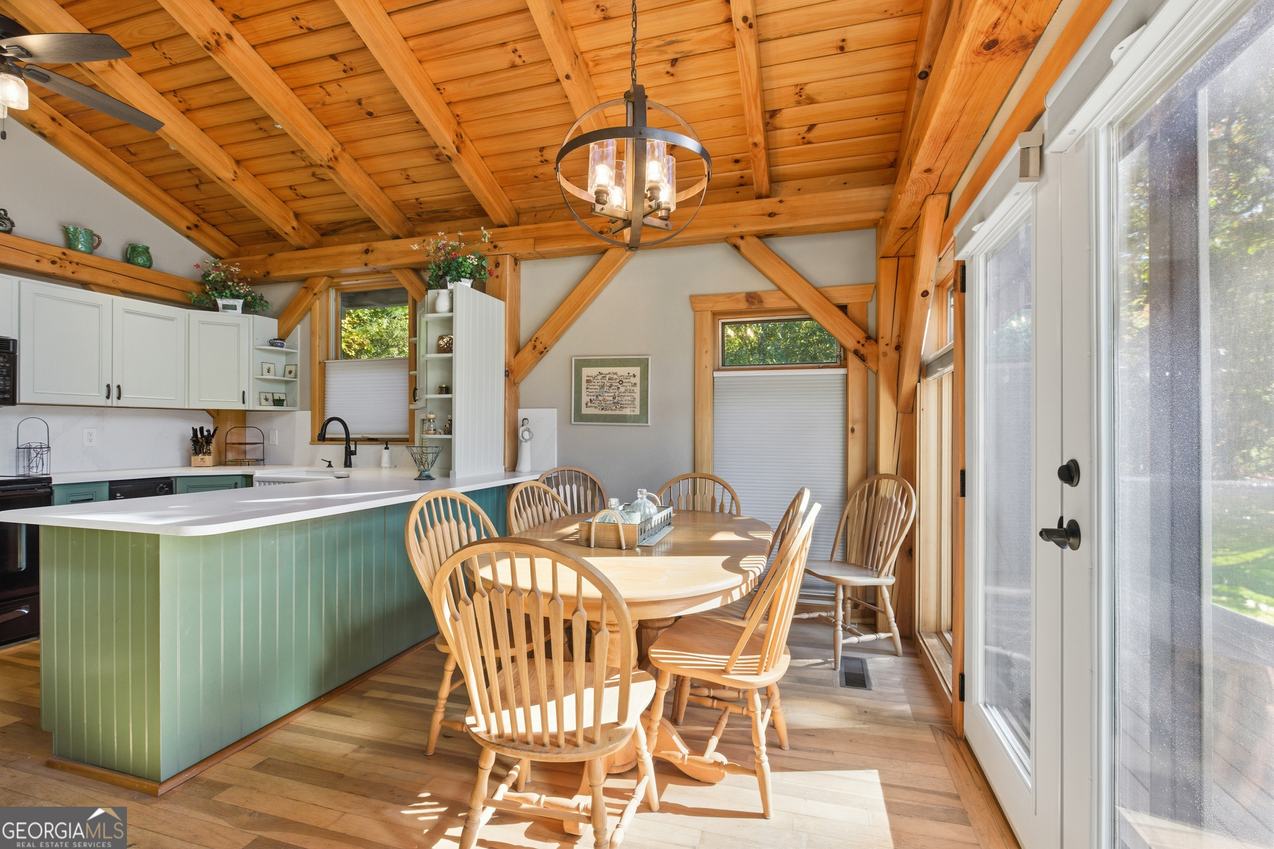 526 Grandaddy Still Road Scaly Mountain, NC 28775 - Photo 13 of 65 a dining room with furniture and a chandelier