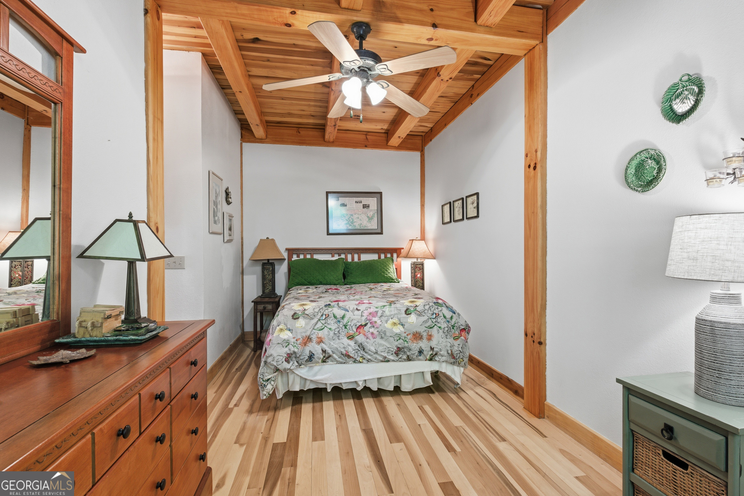 526 Grandaddy Still Road Scaly Mountain, NC 28775 - Photo 15 of 65 a bedroom with a bed and a flat tv screen on dresser