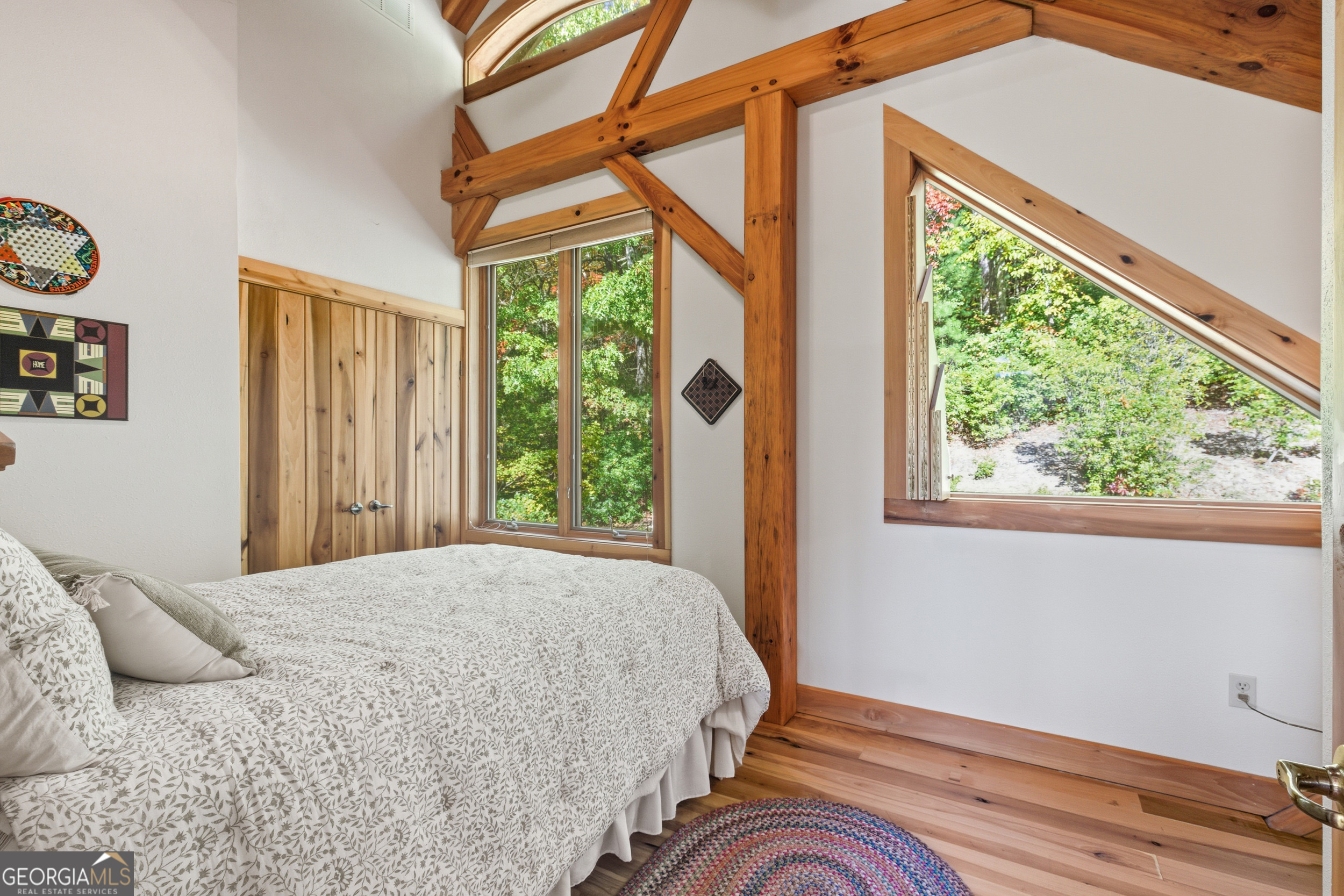 526 Grandaddy Still Road Scaly Mountain, NC 28775 - Photo 29 of 65 a bedroom with a bed and a window