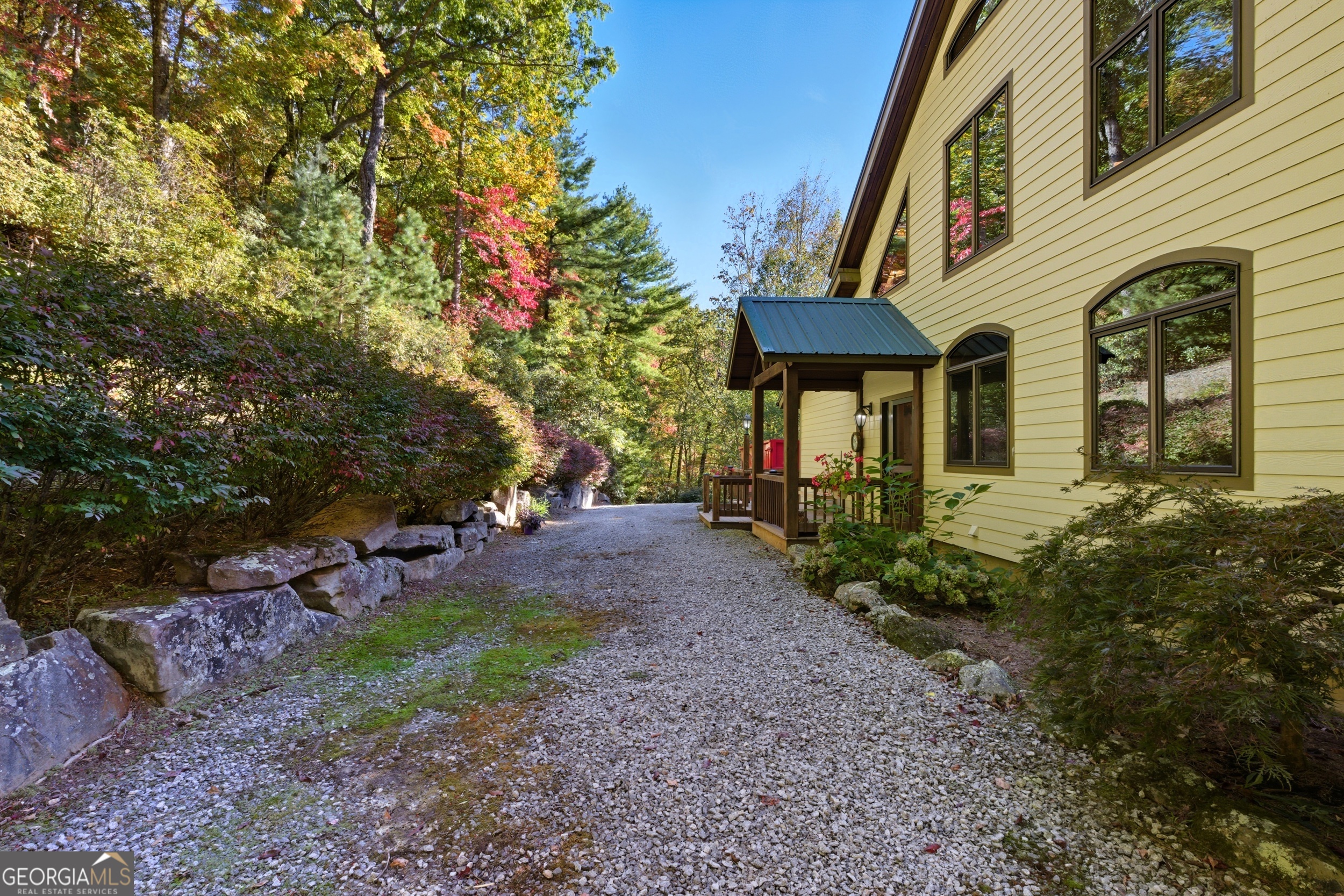 526 Grandaddy Still Road Scaly Mountain, NC 28775 - Photo 36 of 65 a front view of a house with a yard