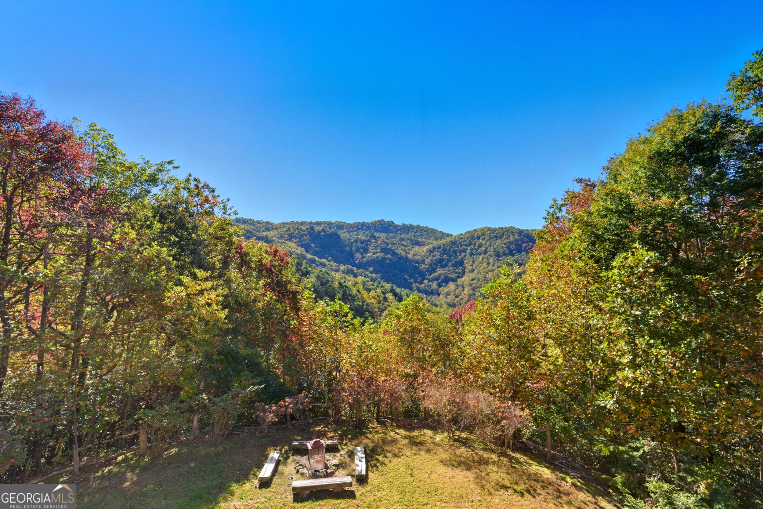 526 Grandaddy Still Road Scaly Mountain, NC 28775 - Photo 38 of 65 a view of a house with a mountain in the background