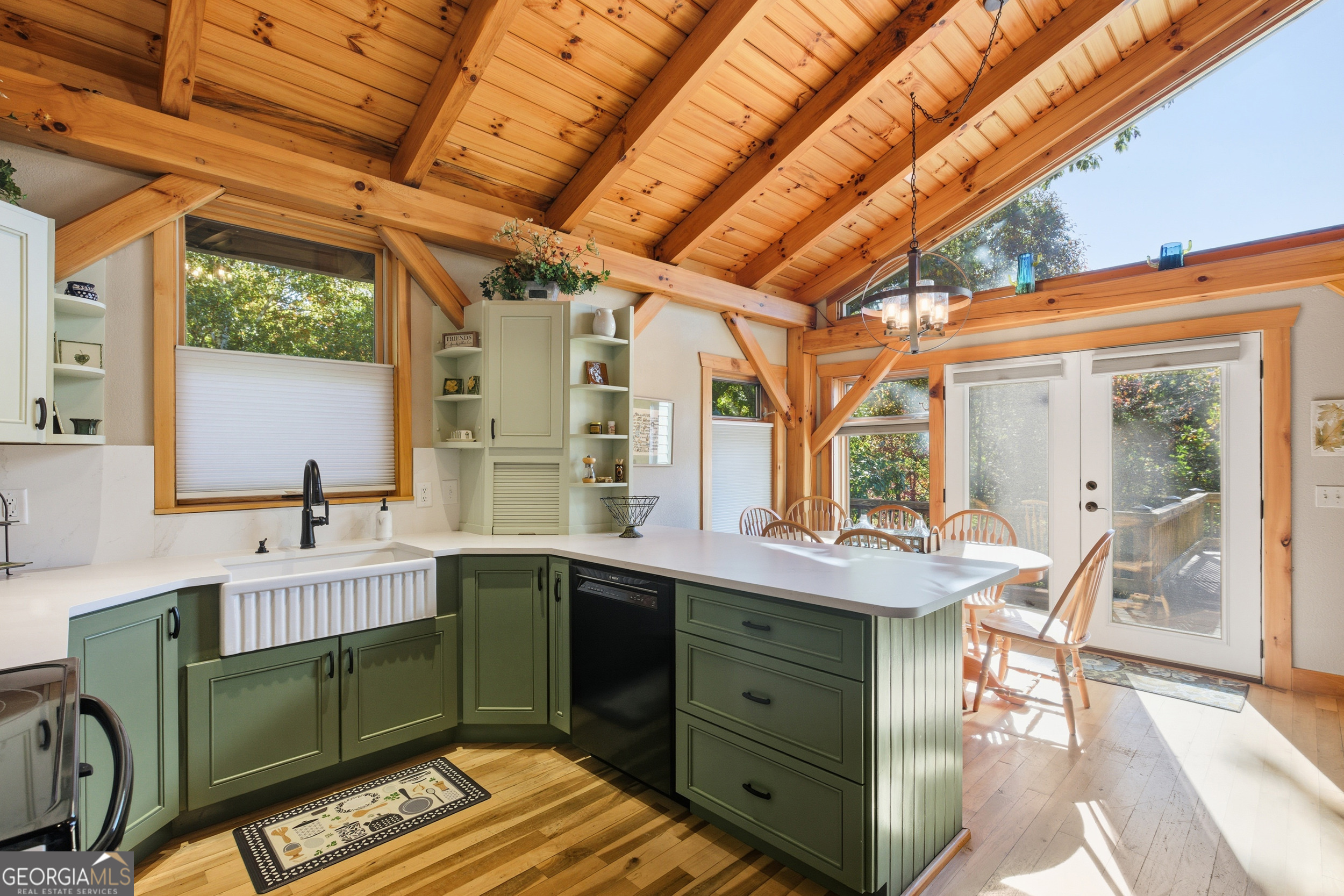 526 Grandaddy Still Road Scaly Mountain, NC 28775 - Photo 4 of 65 a kitchen with a sink appliances and a large window