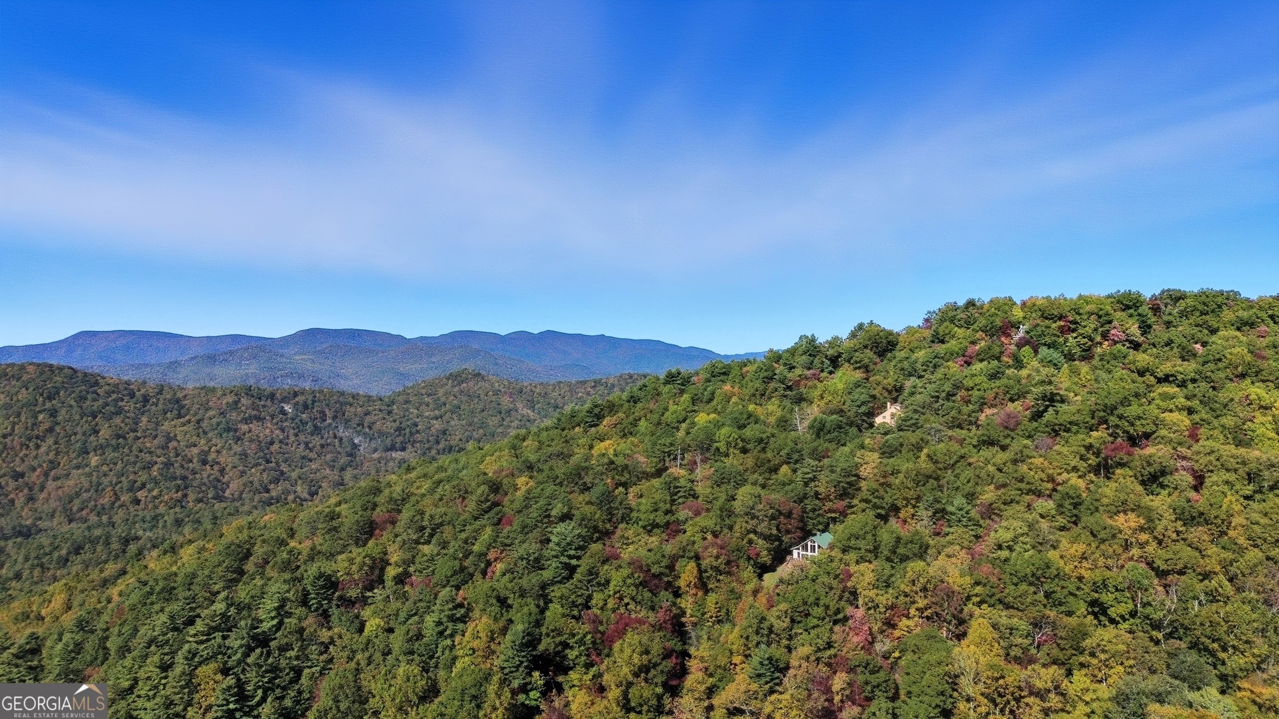 526 Grandaddy Still Road Scaly Mountain, NC 28775 - Photo 42 of 65 a view of a city with a mountain in the background