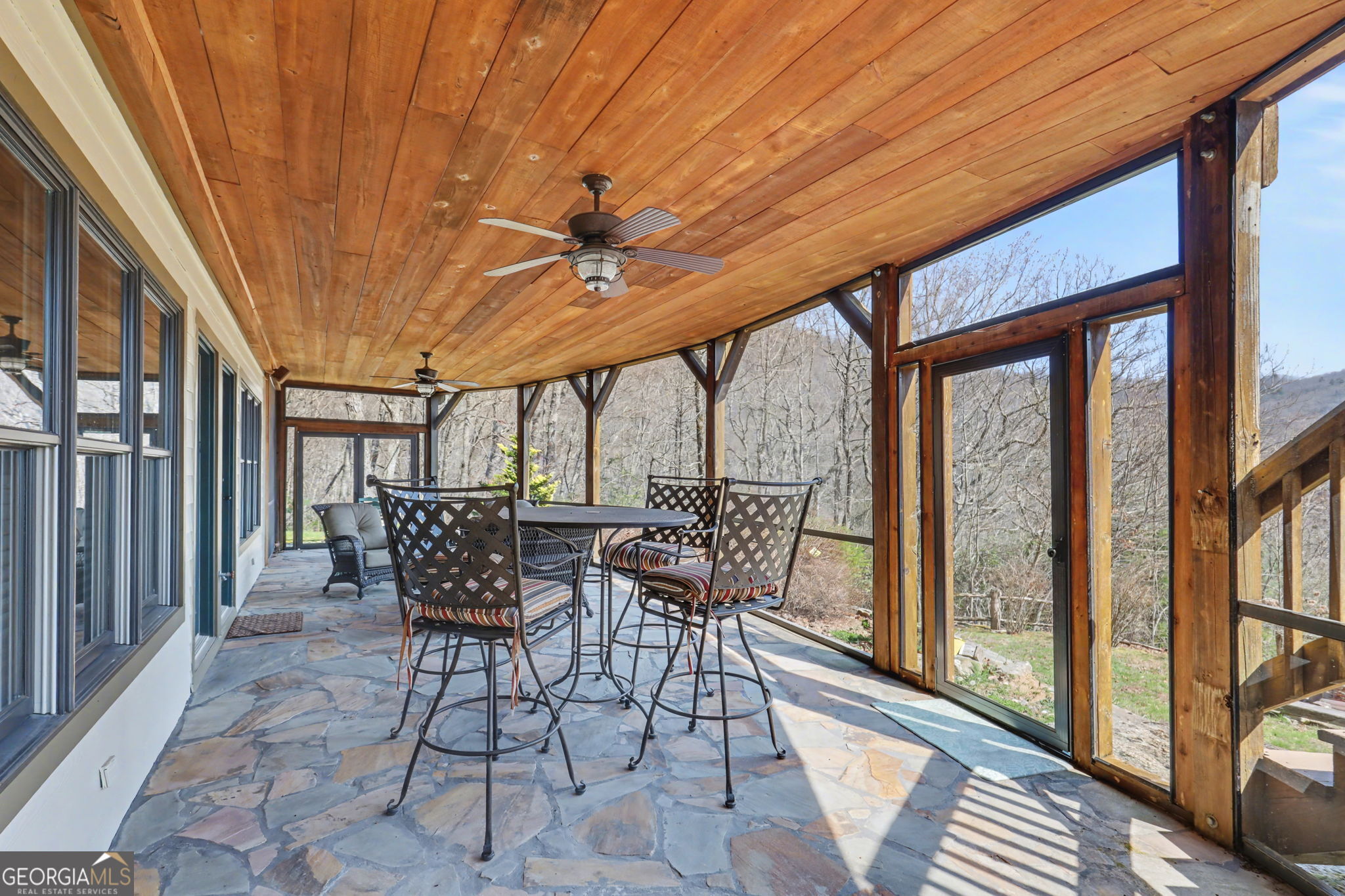 526 Grandaddy Still Road Scaly Mountain, NC 28775 - Photo 61 of 65 a view of a patio with a table chairs and a backyard