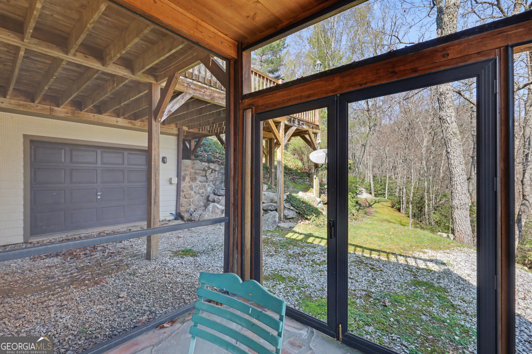 526 Grandaddy Still Road Scaly Mountain, NC 28775 - Photo 62 of 65 a view of a porch with a table and chairs