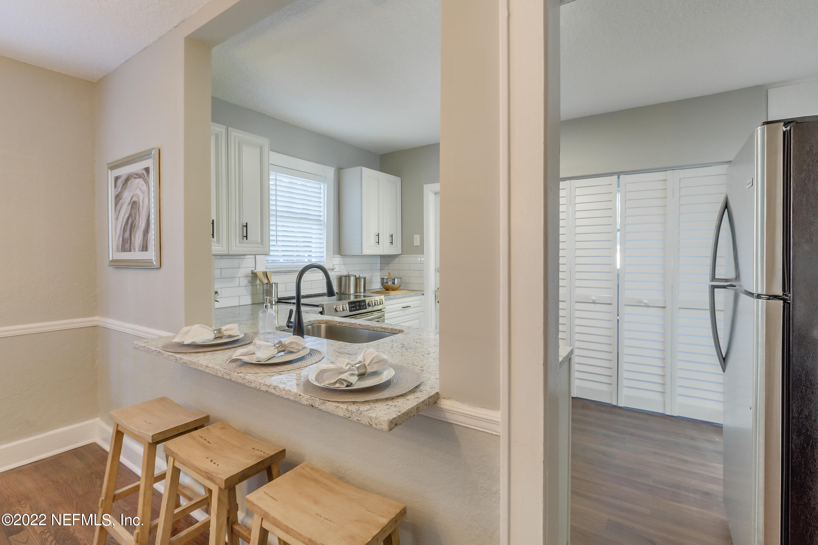4012 Myra Street Jacksonville, FL 32205 - Photo 19 of 38 a view of a dining room and livingroom with furniture