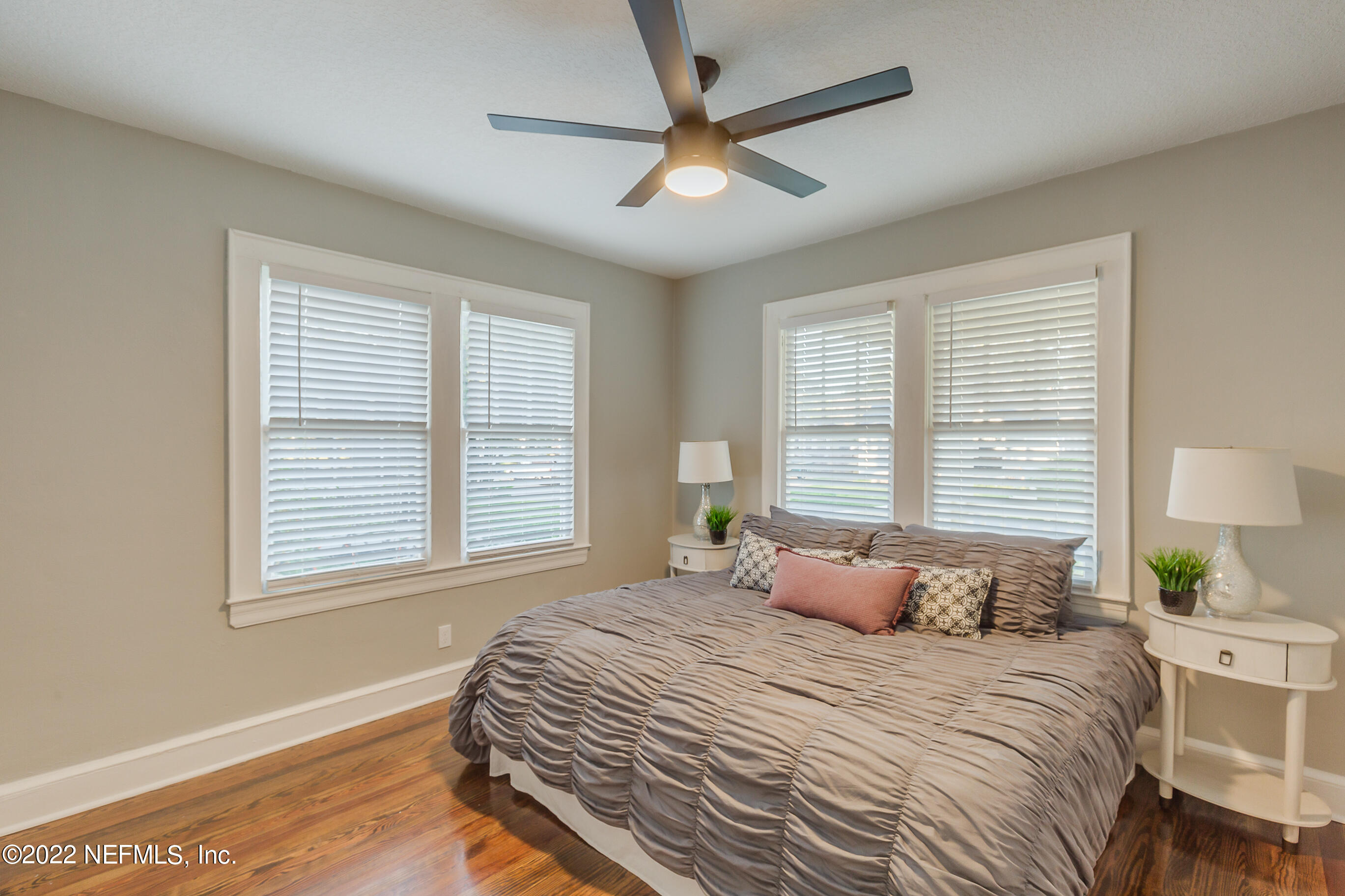 4012 Myra Street Jacksonville, FL 32205 - Photo 36 of 38 a bedroom with a bed a dresser and a window