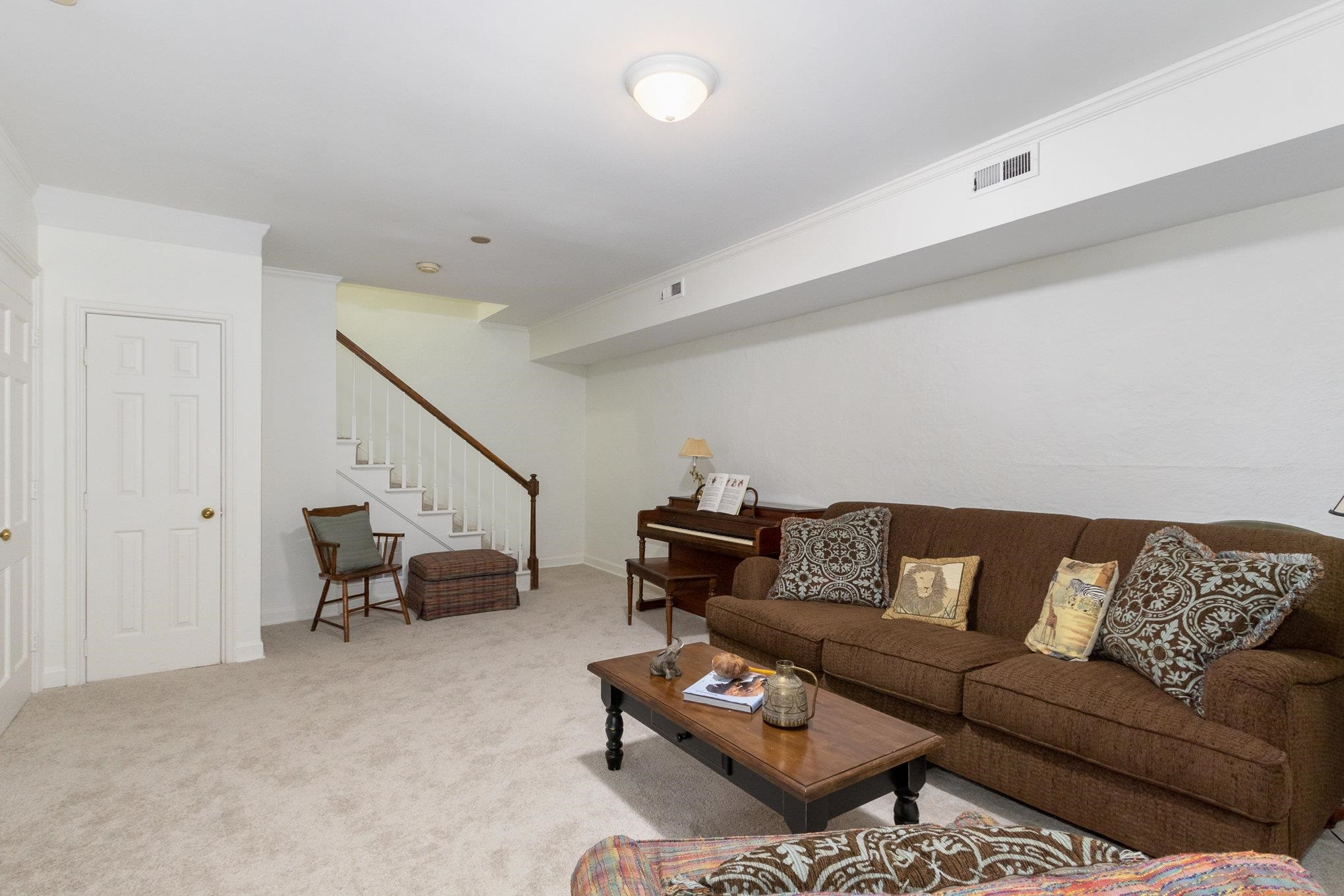 3327 Landor Road Raleigh, NC 27609 - Photo 47 of 60 a living room with furniture and white walls