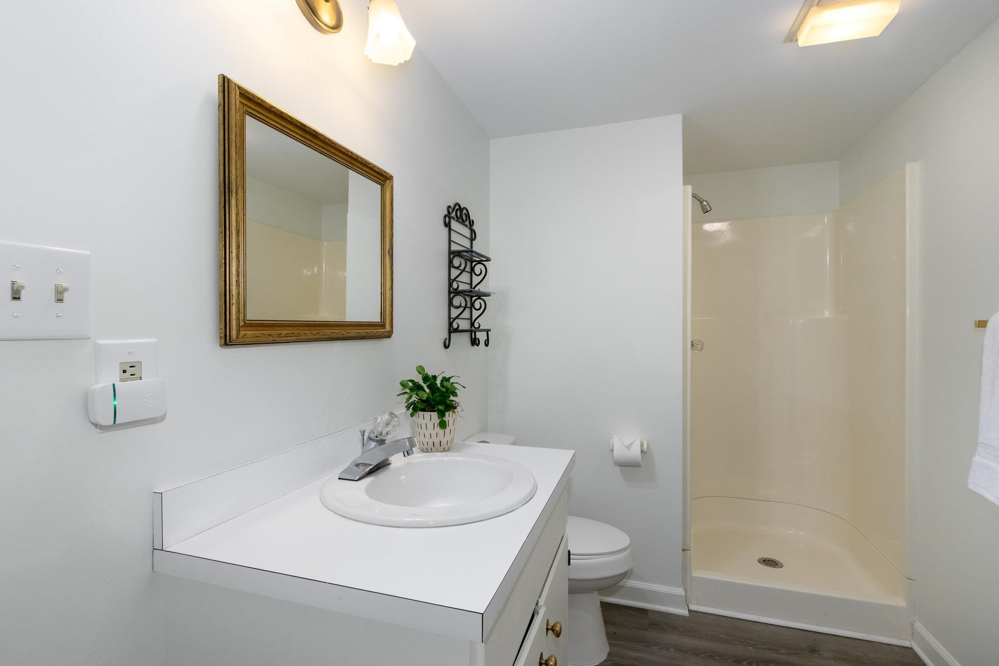 3327 Landor Road Raleigh, NC 27609 - Photo 49 of 60 a bathroom with a sink a toilet and shower