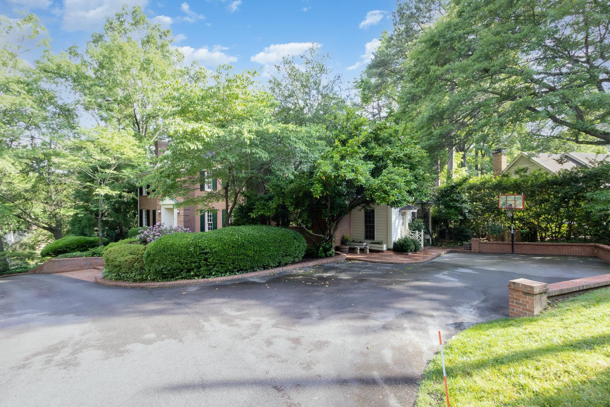 3327 Landor Road Raleigh, NC 27609 - Photo 54 of 60 a front view of a house with a yard and garage
