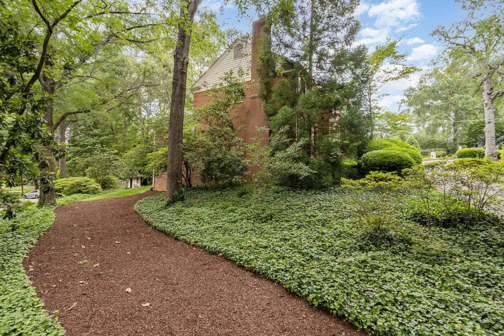 3327 Landor Road Raleigh, NC 27609 - Photo 60 of 60 a view of a garden with a tree