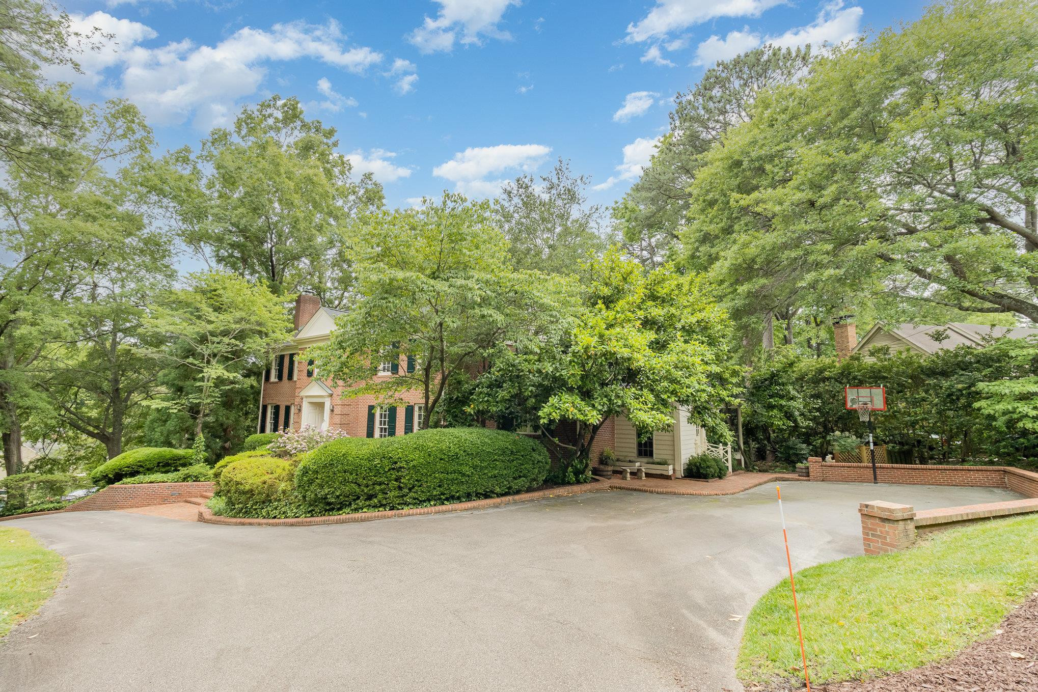3327 Landor Road Raleigh, NC 27609 - Photo 6 of 60 a view of a house with backyard and trees