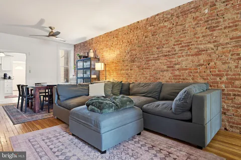 a living room with furniture and a rug