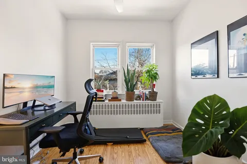 a bedroom with furniture and a window