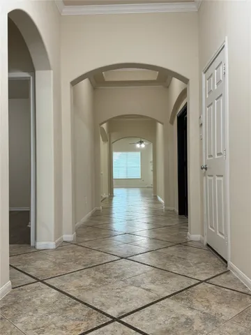 a view of a hallway view with wooden floor and staircase