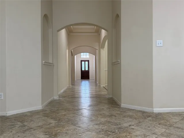 a view of gallery with wooden floor