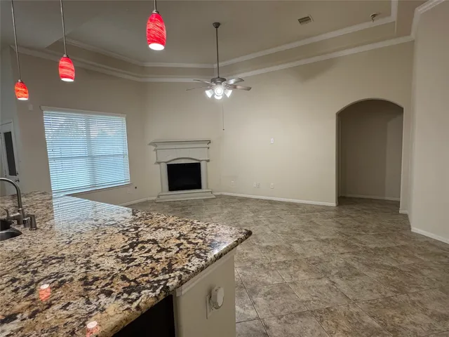 a view of a kitchen with a sink and chandelier