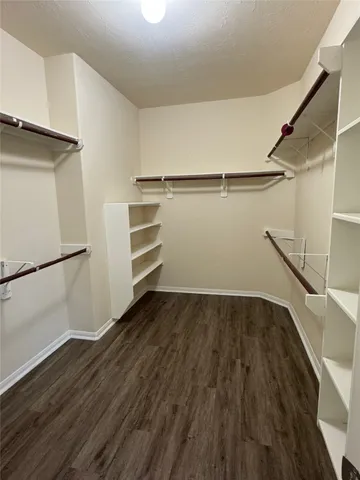 a view of an empty walk in closet